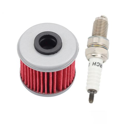 Red oil filter and spark plug on a white background